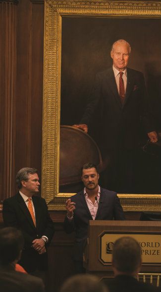 I’m proud to say that I grew up in the same corner of Iowa as Nobel Peace Prize winner Norman Borlaug, who is portrayed behind me in this beautiful oil at the World Food Prize Hall of Laureates. Mr. Borlaug is a hero to all of us in Iowa. Through his research, he was able to feed billions around the world. Standing beside me is Land Report Editor Eric O’Keefe, which is kind of appropriate. Eric thinks he is a Nobel Prize winner too.